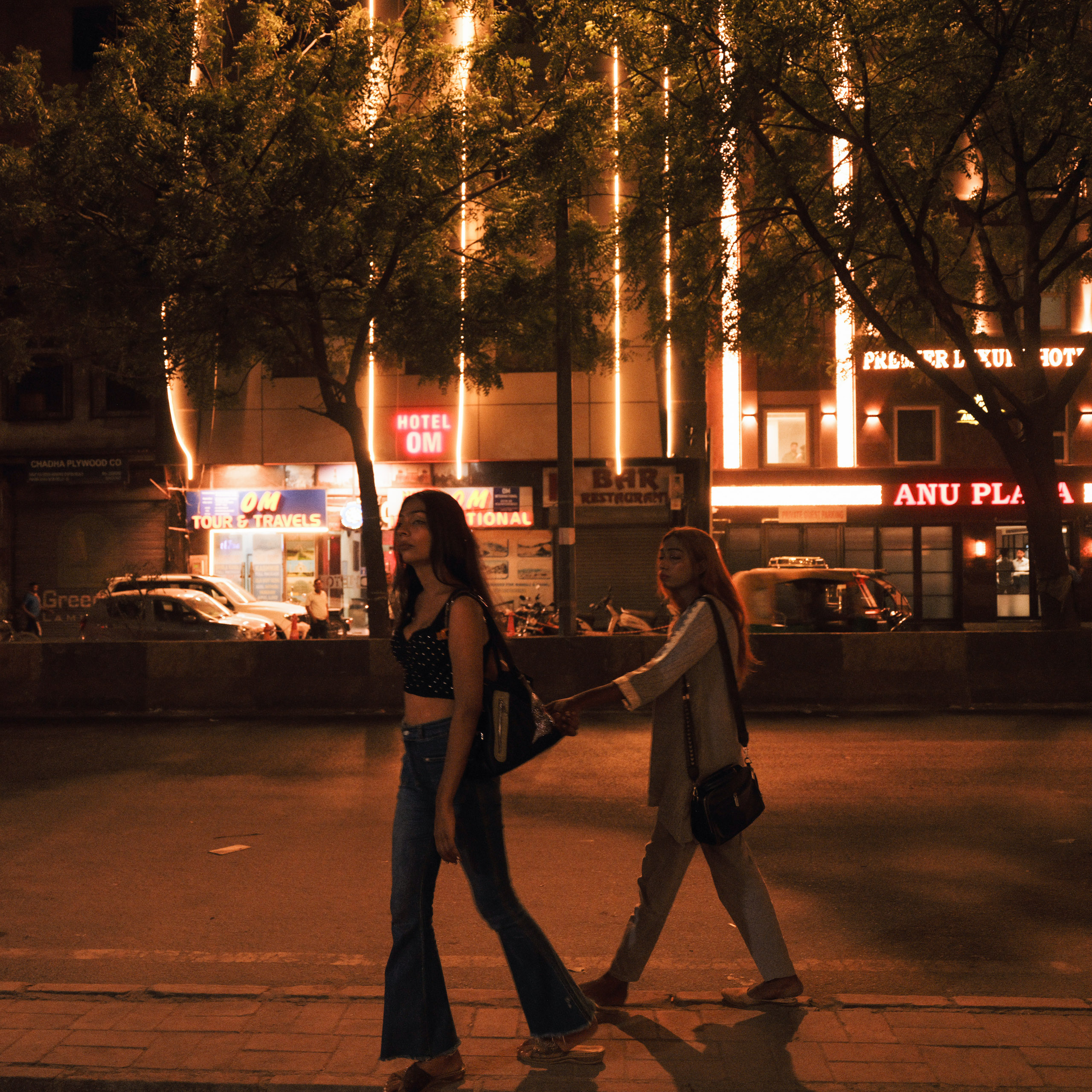 two women on street at night