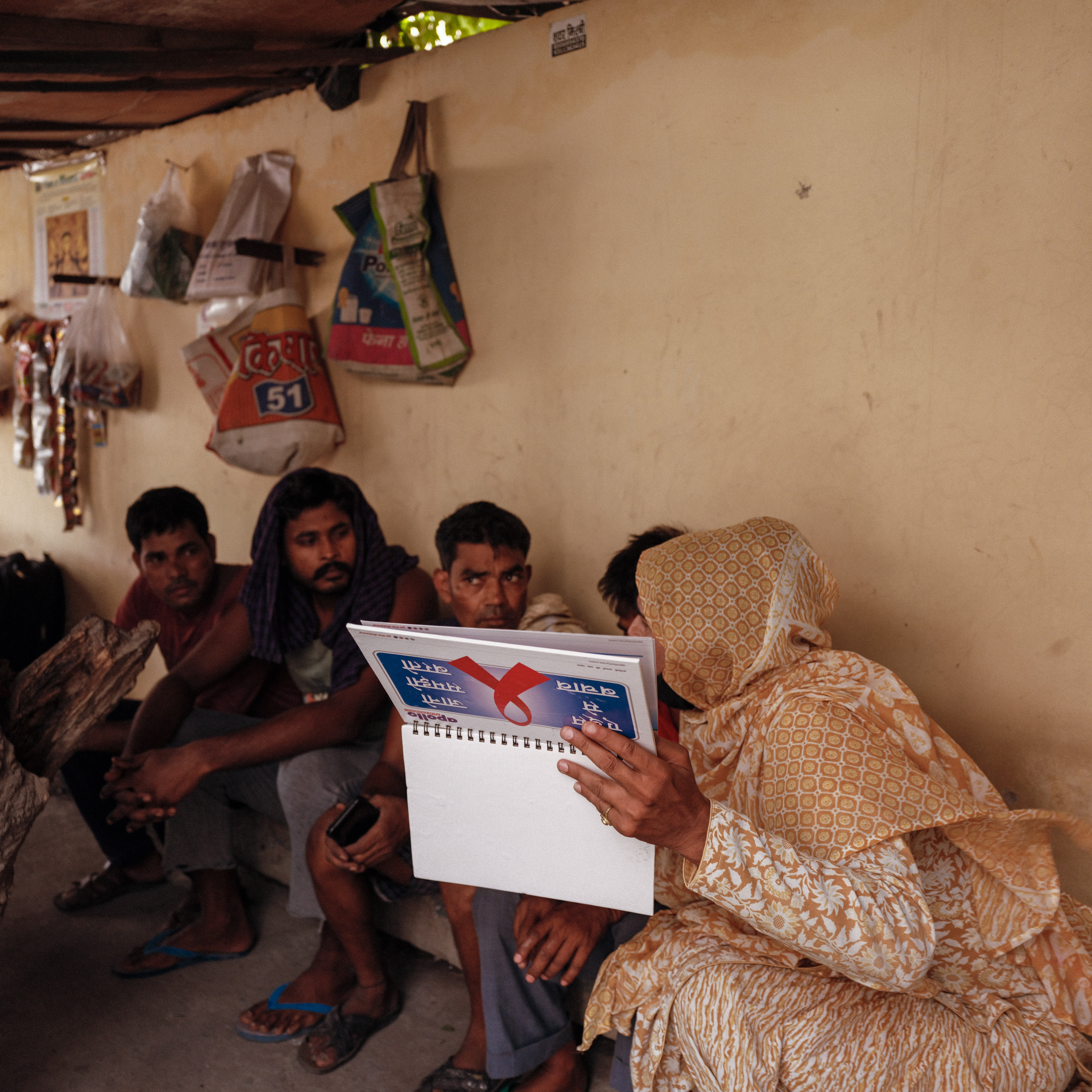 people seated against wall