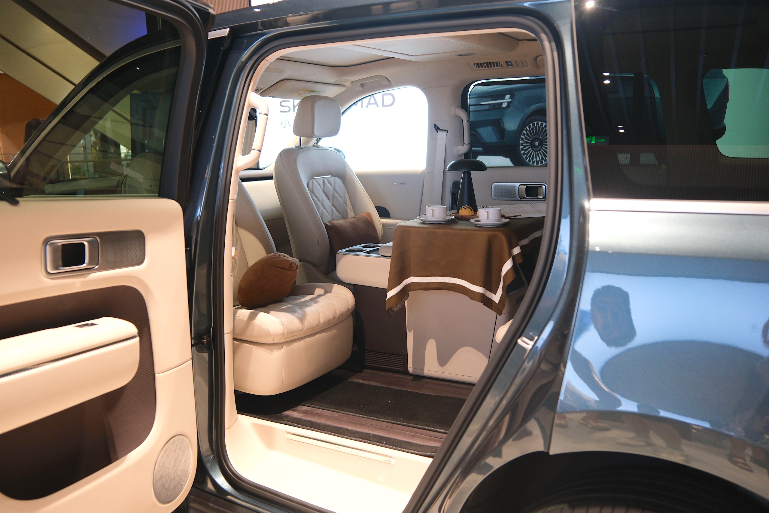 Attachment Details

A dining table inside an electric SUV