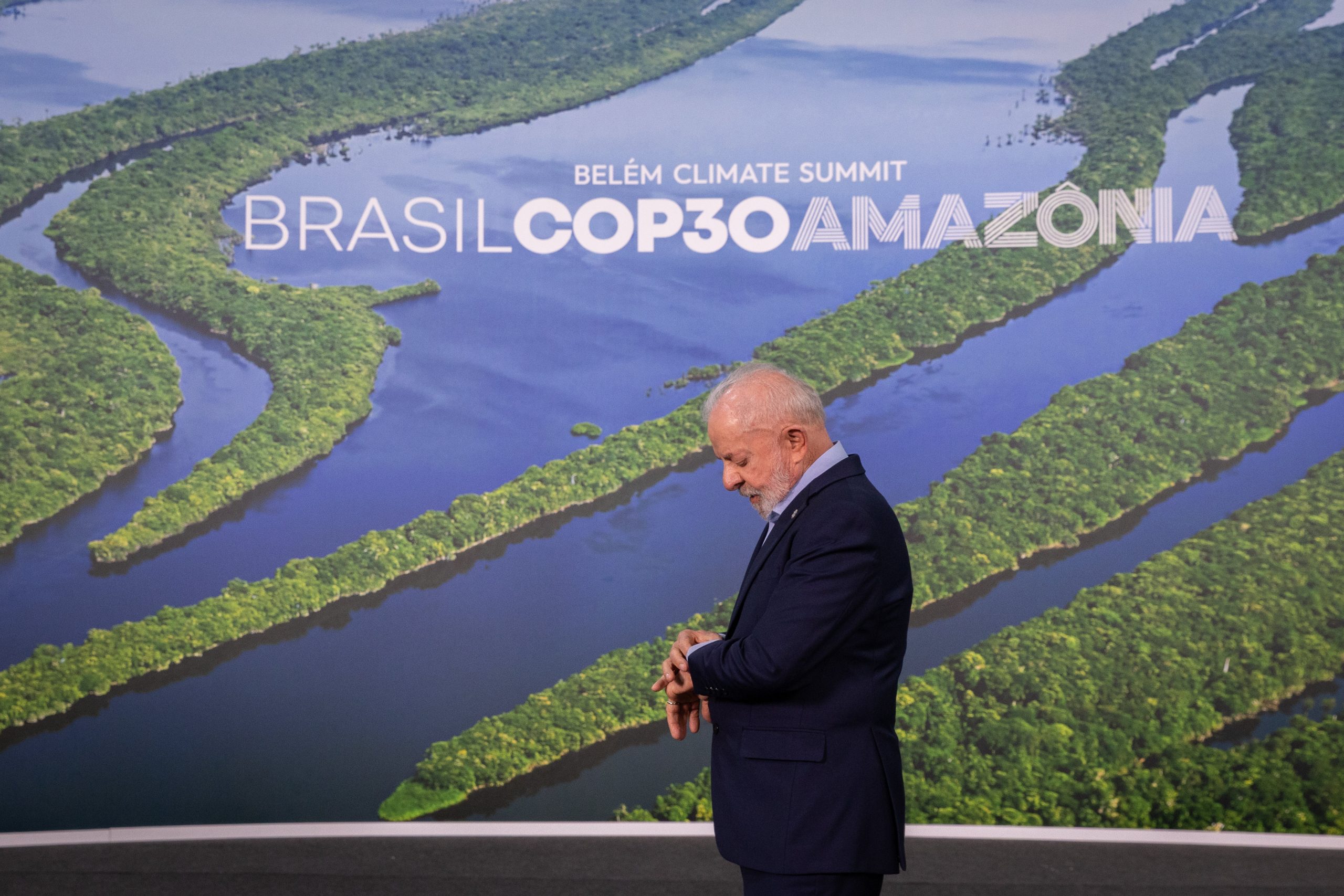 President Lula of Brazil standing beneath COP30 sign