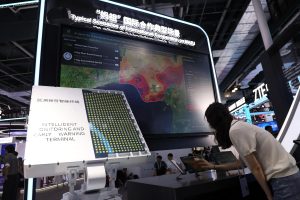 woman interacting with large screen
