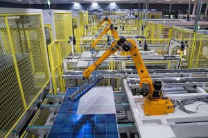 Robot arms at a photovoltaic module production line