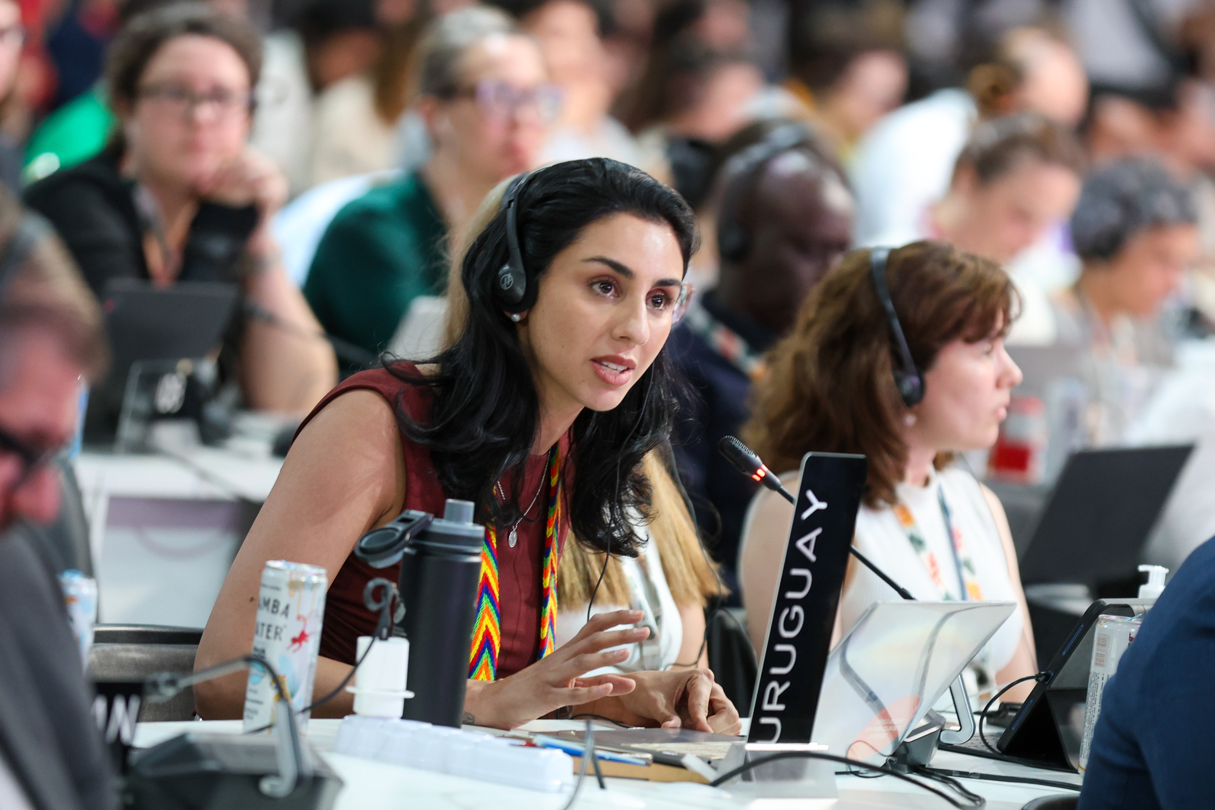 seated woman speaking into microphone