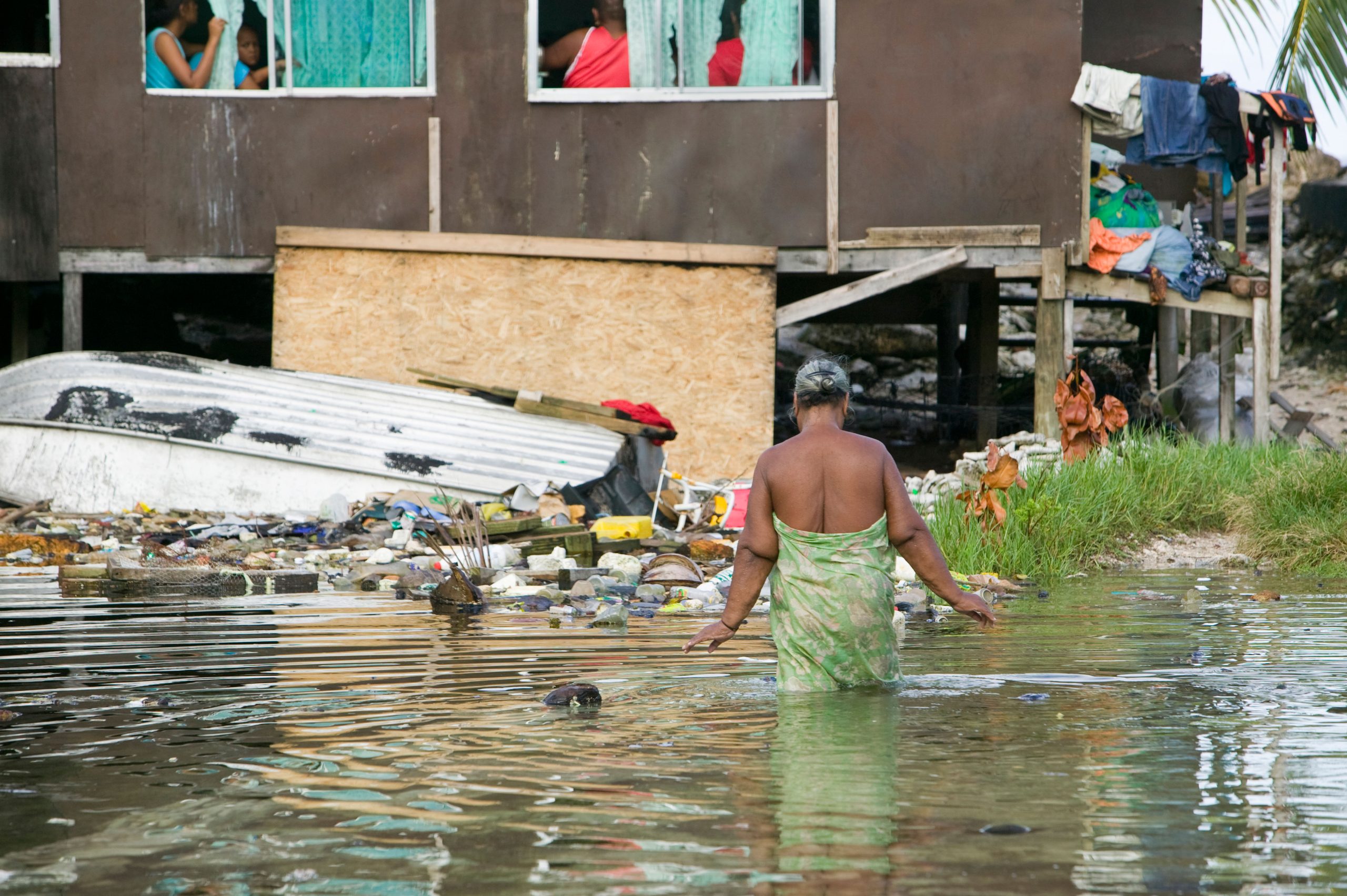 <p>Houses flooded by seawater incursion onto Tuvalu’s Funafuti atoll. Coastal defences on the island are having to be strengthened to cope with rising sea levels and intensifying storms caused by climate change (Image: Ashley Cooper pics / Alamy)</p>