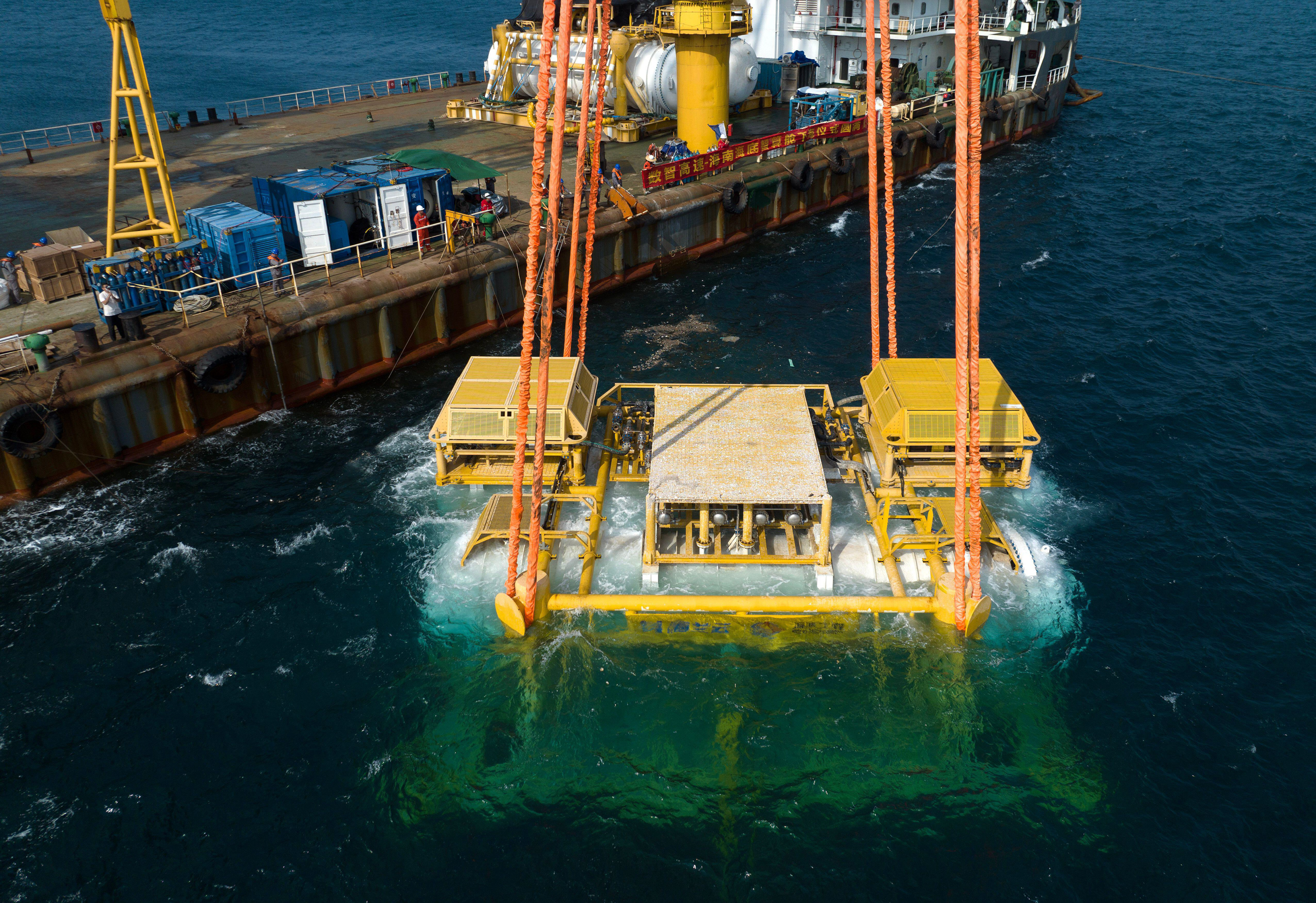 <p>A Chinese firm launches two capsules housing AI data servers into the sea off Hainan (Image: Xinhua / Alamy)</p>