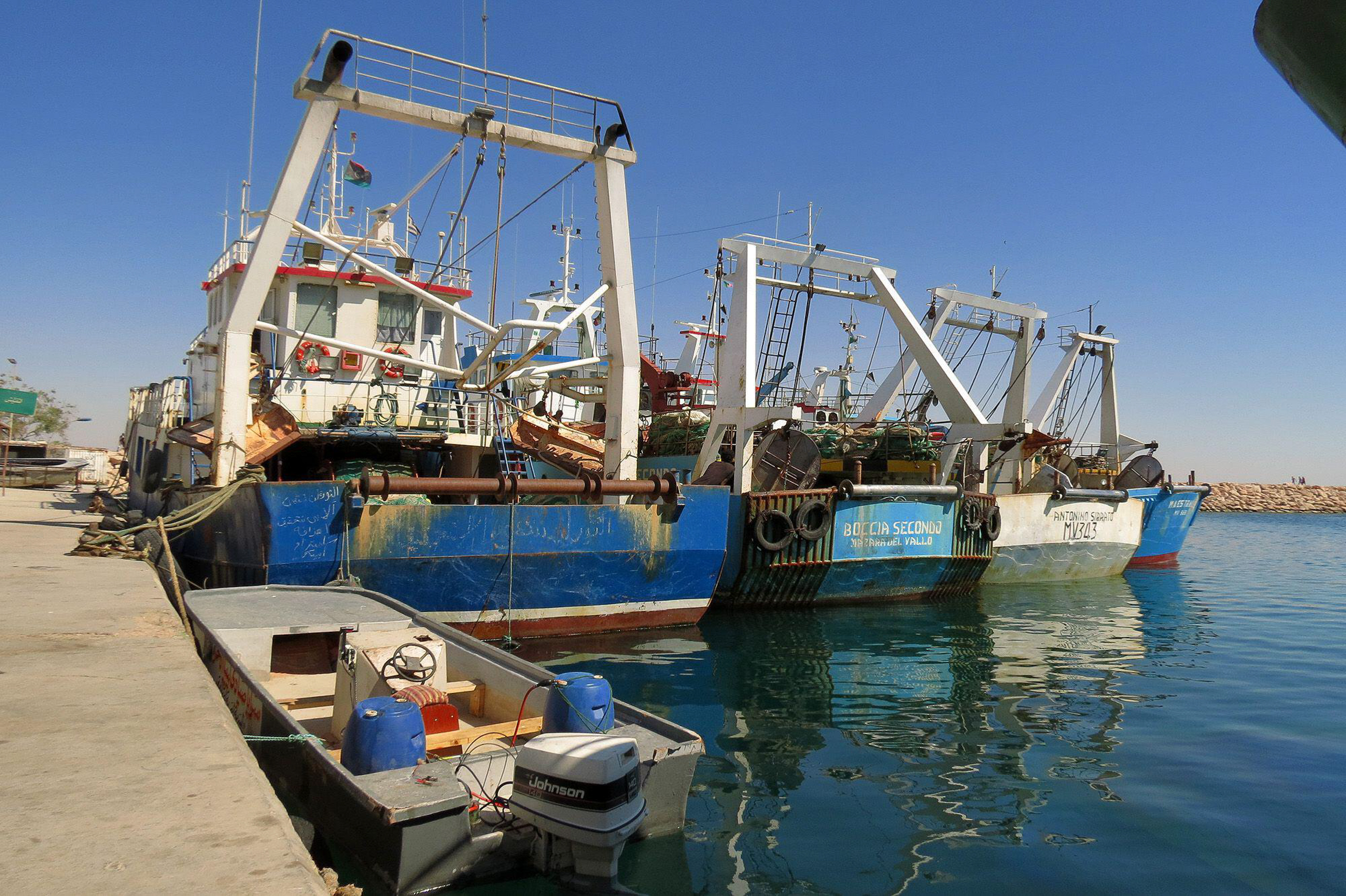 <p>Libya has long had a fraught relationship with foreign fishing. In 2012, these Italian boats were seized by authorities and taken to Benghazi (Image: Ibrahim Alaguri / Associated Press/ Alamy)</p>