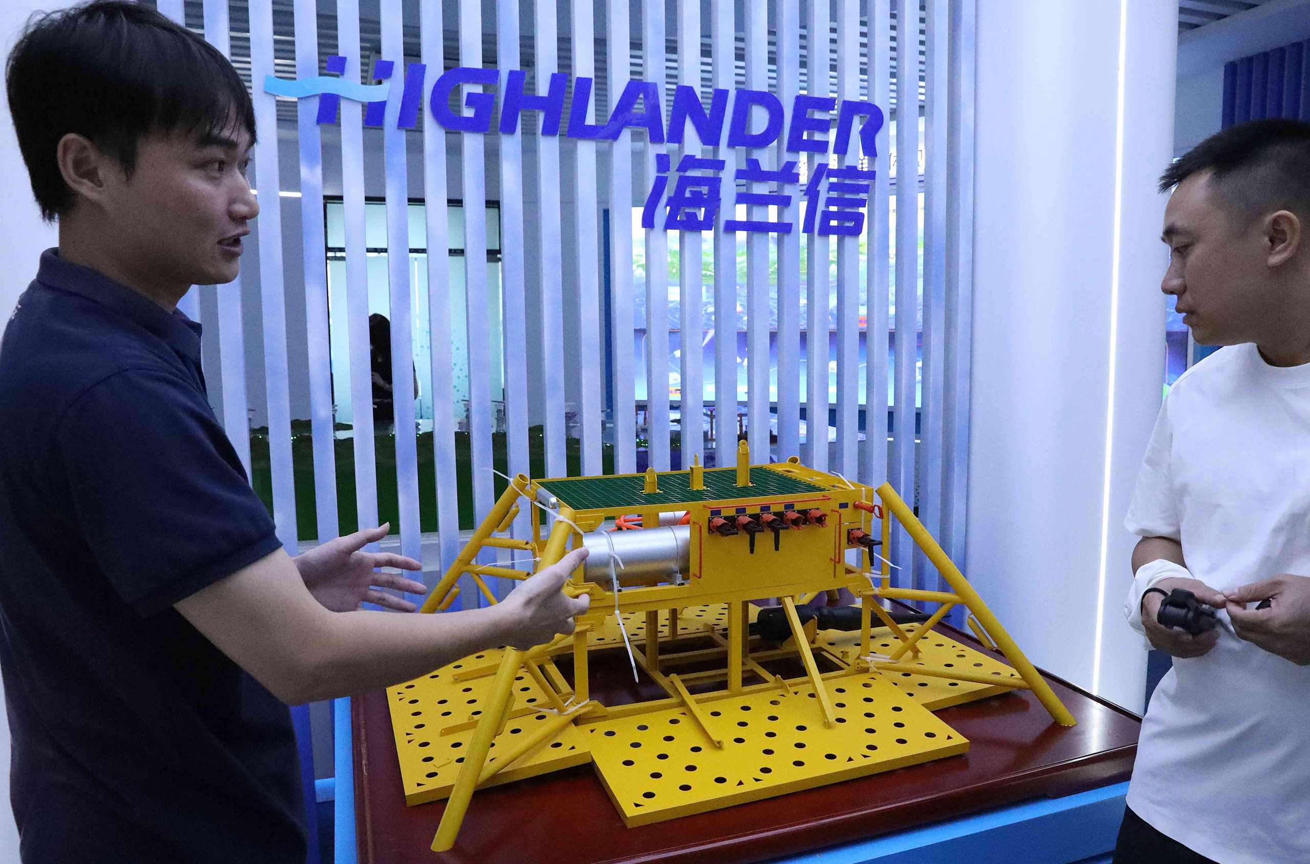 two men observing undersea data centre model