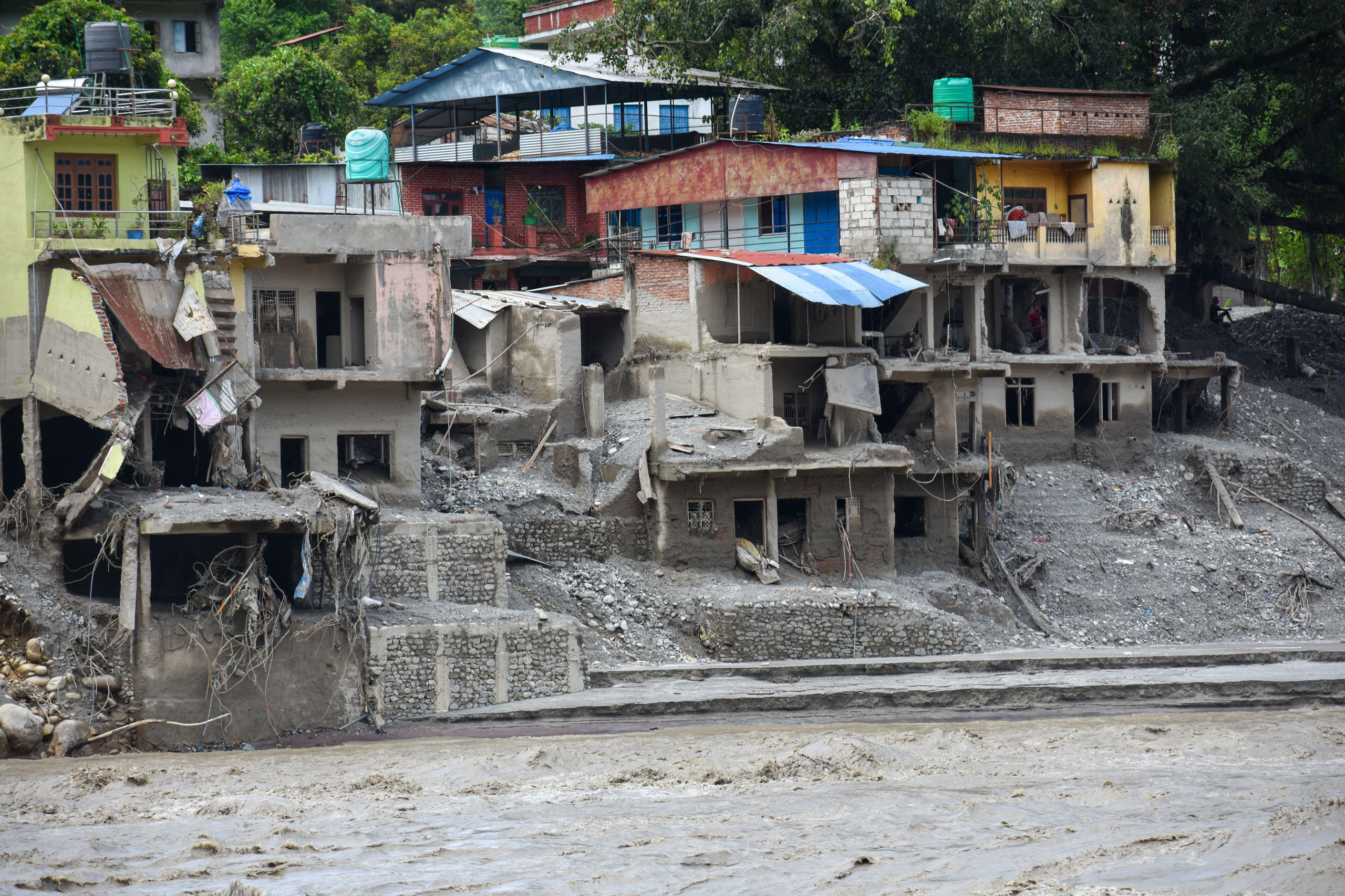 <p>Houses damaged by the August 2026 floods in Nuwakot district, Nepal. Some flood victims had resettled in the area after being displaced by the 2015 earthquake (Image: Sunil Pradhan / Abaca Press / Alamy)</p>