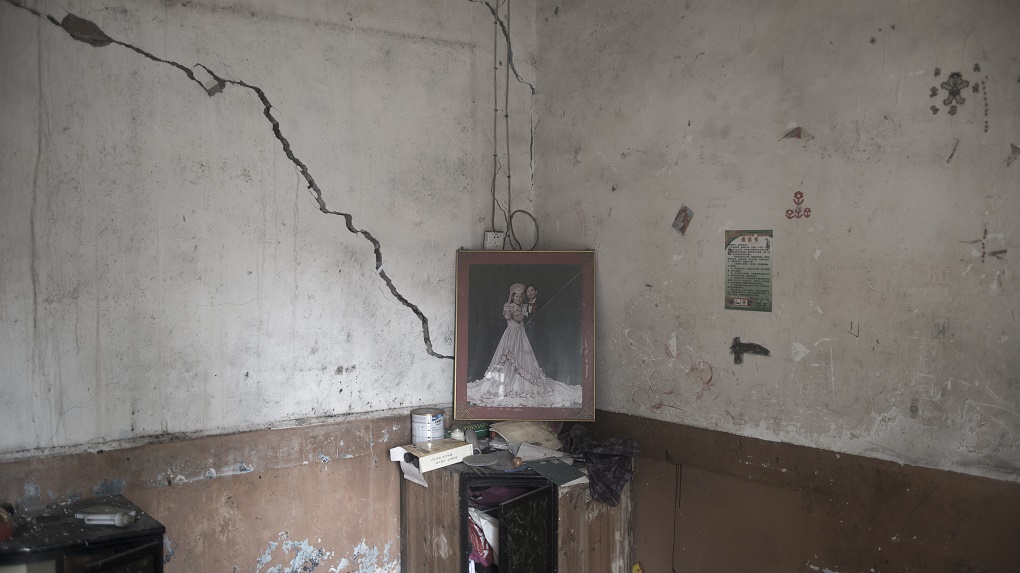 Wedding photographs left behind in an abandoned home show how quickly residents left.