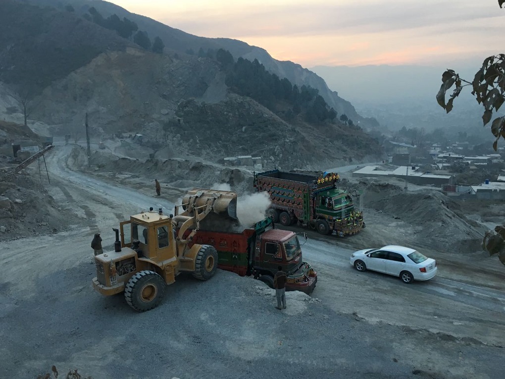 Crushed stone being transported away [image by Mohammad Zubair Khan]