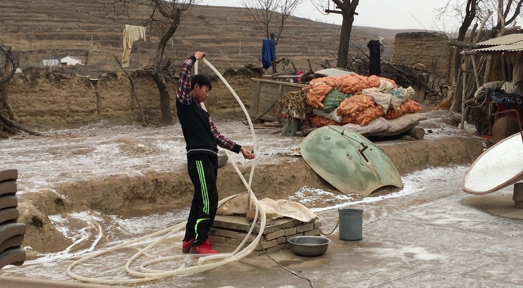 Villagers rely on rainwater stored in underground cisterns for drinking water [image by Kang Ning]